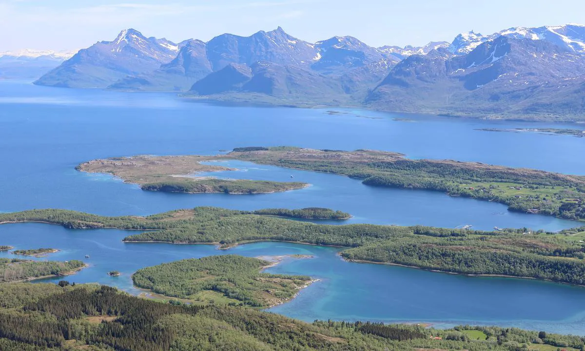 Innerpollen: Picture taken from a hike to Sætertinden, you see the whole area with the mainland in the background. The anchorage is the far away bay a little to the left.